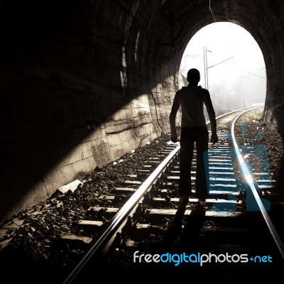 Man Standing In Train Tunnel Stock Photo