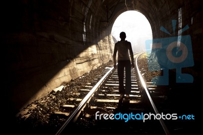 Man Standing In Train Tunnel Stock Photo