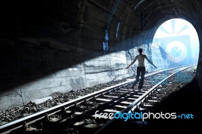 Man Standing In Train Tunnel Stock Photo