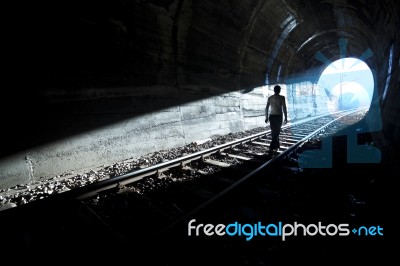 Man Standing In Train Tunnel Stock Photo