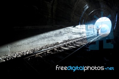 Man Standing In Train Tunnel Stock Photo