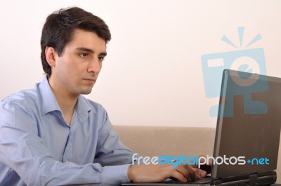 Man Surfing The Web Stock Photo