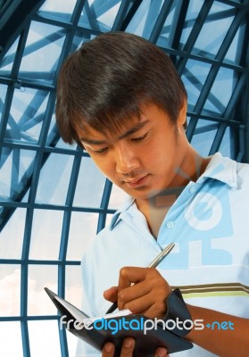 Man Taking Notes Stock Photo