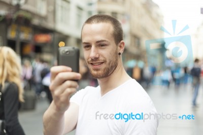 Man Taking Photo With Mobile Phone Stock Photo