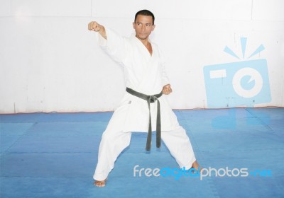 Man Training Karate In The Gym Stock Photo