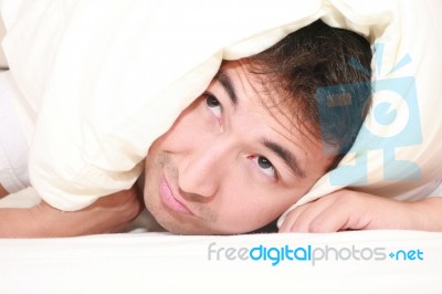 Man Trying To Sleep With Pillow Stock Photo