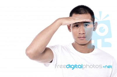 Man Trying To View An Onject Stock Photo