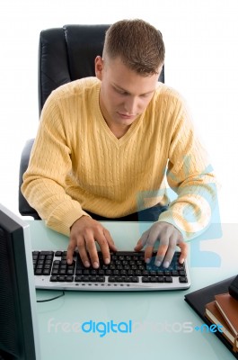 Man Typing Something On Computer Stock Photo