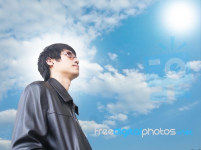 Man Under Blue Sky Stock Photo