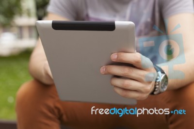 Man Use Tablet Reading News And Communicate On Social Networks Stock Photo