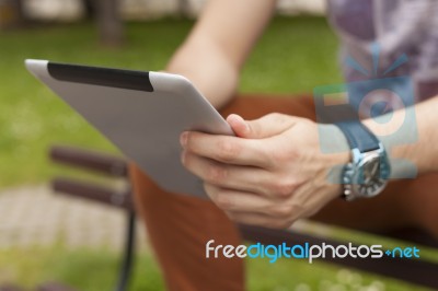 Man Use Tablet Reading News And Communicate On Social Networks Stock Photo