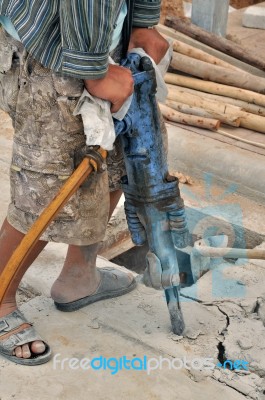 Man Using Jackhammer Stock Photo