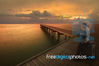 Man Waiting For Plane Fligh On Pier Stock Photo