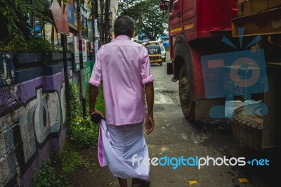 Man Walking Though The Streets Of India Stock Photo