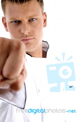 Man Wearing Chef Uniform With A Forward Fist Stock Photo