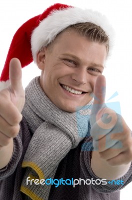 Man Wearing Santa Hat and Thumb Up Stock Photo