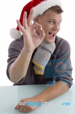 Man Wearing Santa Hat With Gesture Stock Photo