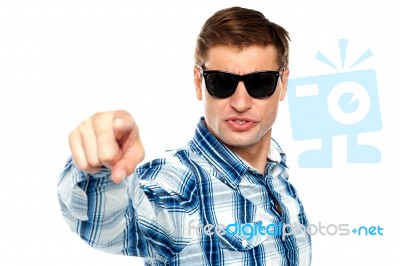 Man Wearing Sunglasses And Pointing Stock Photo