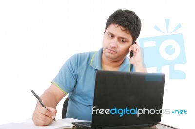 Man With Cell Phone And Laptop Stock Photo