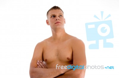 Man With Crossed Arms Looking Up Stock Photo