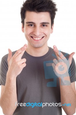 Man With Crossed Fingers Stock Photo