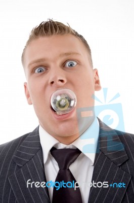 Man With Electric Bulb In His Mouth Stock Photo