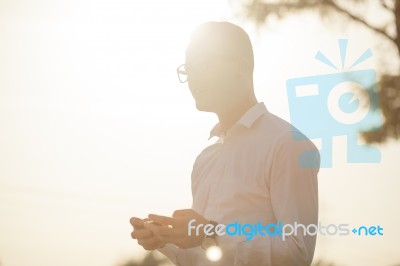 Man With Glasses Speak On Mobile Phone In Hands Stock Photo