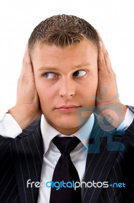 Man With Hands Over Ears Stock Photo