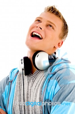 Man With Headphones Around His Neck Stock Photo