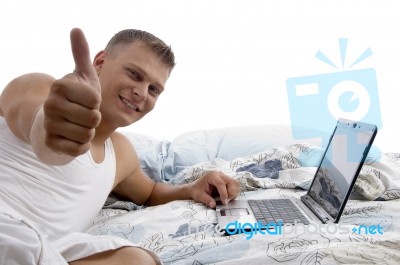 Man With Laptop And Thumbs Up Stock Photo