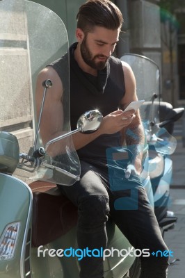 Man With Mobile Phone In Hands Stock Photo