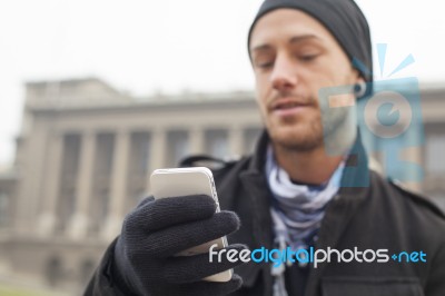 Man With Mobile Phone In Hands Stock Photo