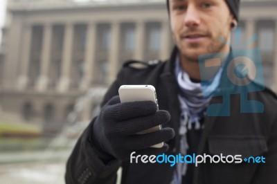 Man With Mobile Phone In Hands Stock Photo