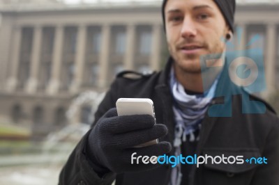 Man With Mobile Phone In Hands Stock Photo