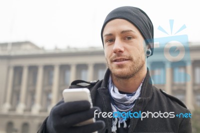 Man With Mobile Phone In Hands Stock Photo