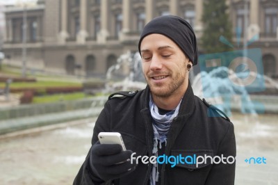 Man With Mobile Phone In Hands Stock Photo