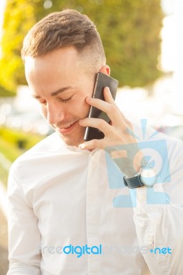 Man With Mobile Phone In Hands Stock Photo