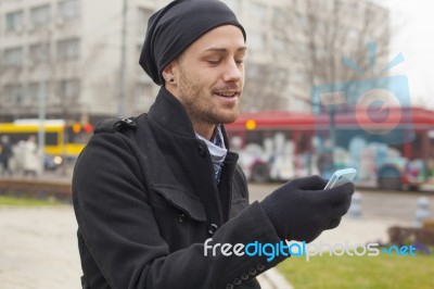 Man With Mobile Phone Traveling Stock Photo