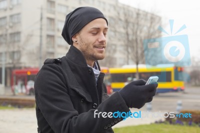 Man With Mobile Phone Traveling Stock Photo