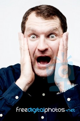 Man With Shocked Facial Expression Stock Photo