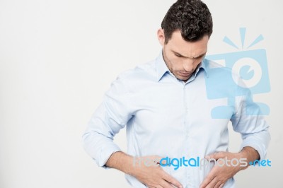 Man With Strong Stomach Pain Stock Photo