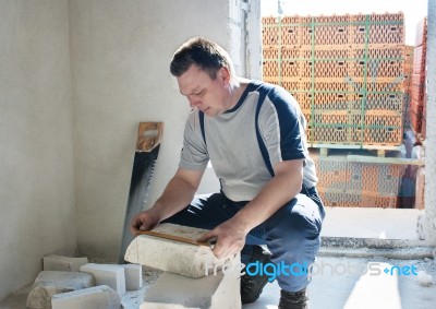 Man Worker Measures The Ruler Silicate Brick Stock Photo