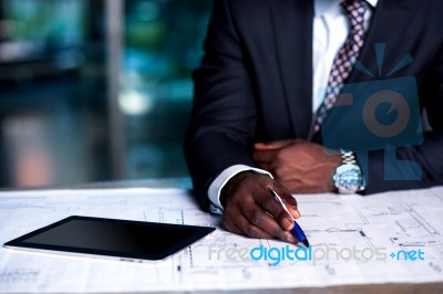 Man Working On Business Development Plan Stock Photo