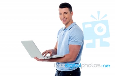 Man Working On His Laptop Stock Photo