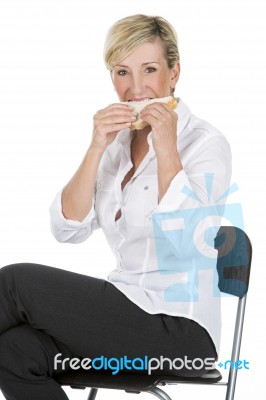 Manager Woman Eating A Sandwich Stock Photo