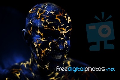 Man's  Face Painted In Neon Uv Lava Stock Photo