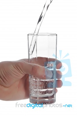 Man's Hand Holding Glass Of Natural Water, Isolated On White Bac… Stock Photo