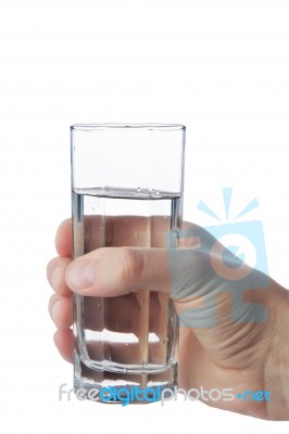 Man's Hand Holding Glass Of Water, Isolated On White Background Stock Photo