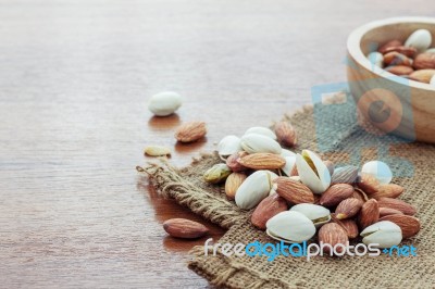 Many Almonds On Sackcloth Stock Photo