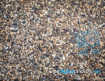 Many Little Stone Are In Concrete Floor Background Stock Photo